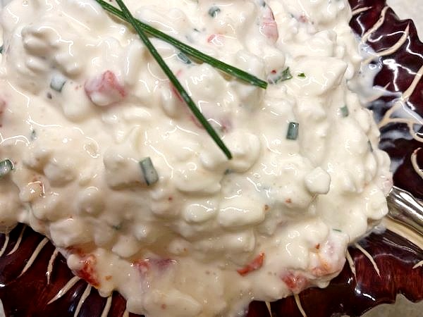 Grandpa's Favorite Cottage Cheese Salad in a red and white striped bowl 