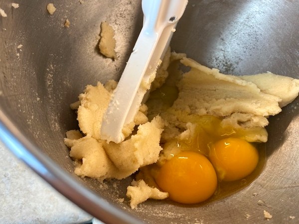 adding eggs to the batter