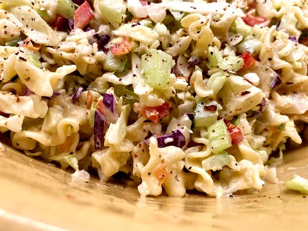 pasta cleslaw salad in a bowl, ready to eat