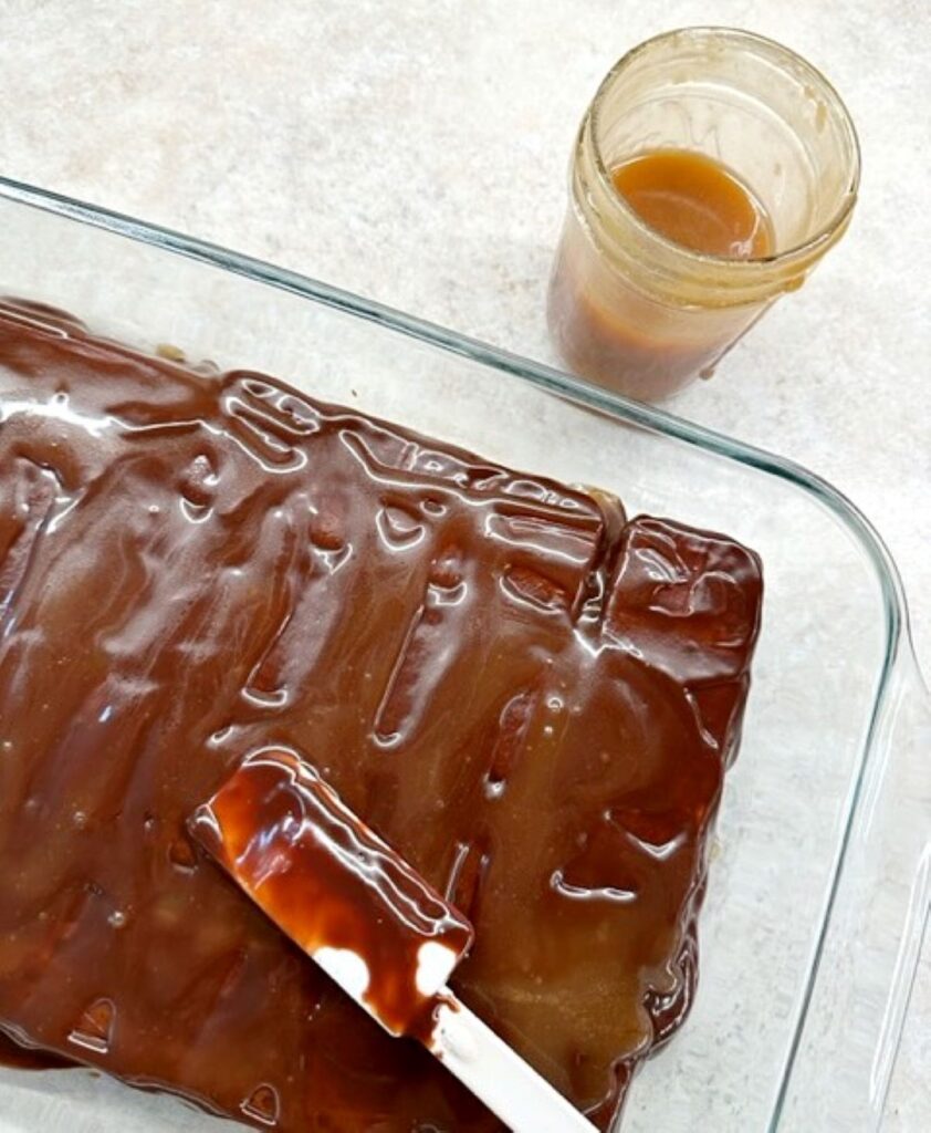 adding caramel sauce to ice cream sandwich dessert