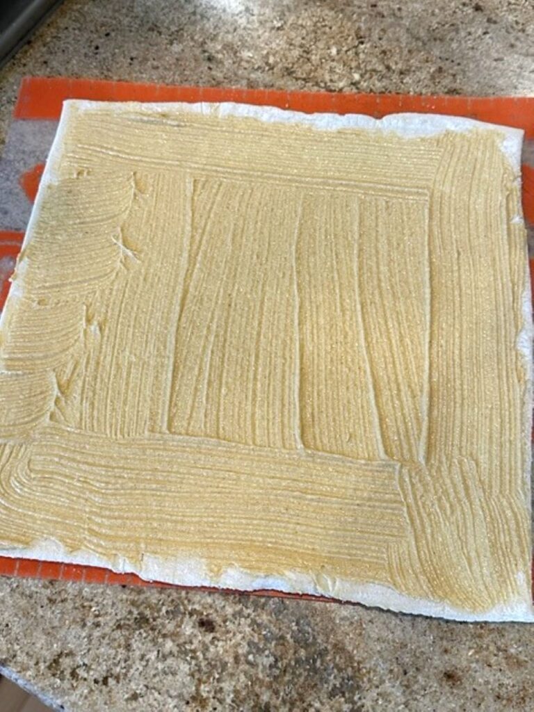 Dijon mustard spread on puff pastry
